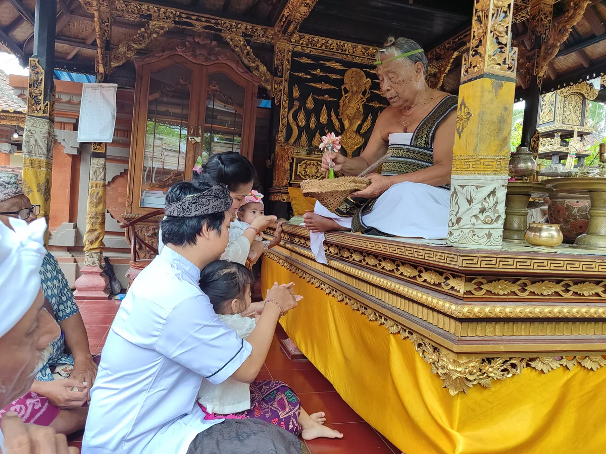 Wayan’s Paon family members taking part in a Balinese ceremony