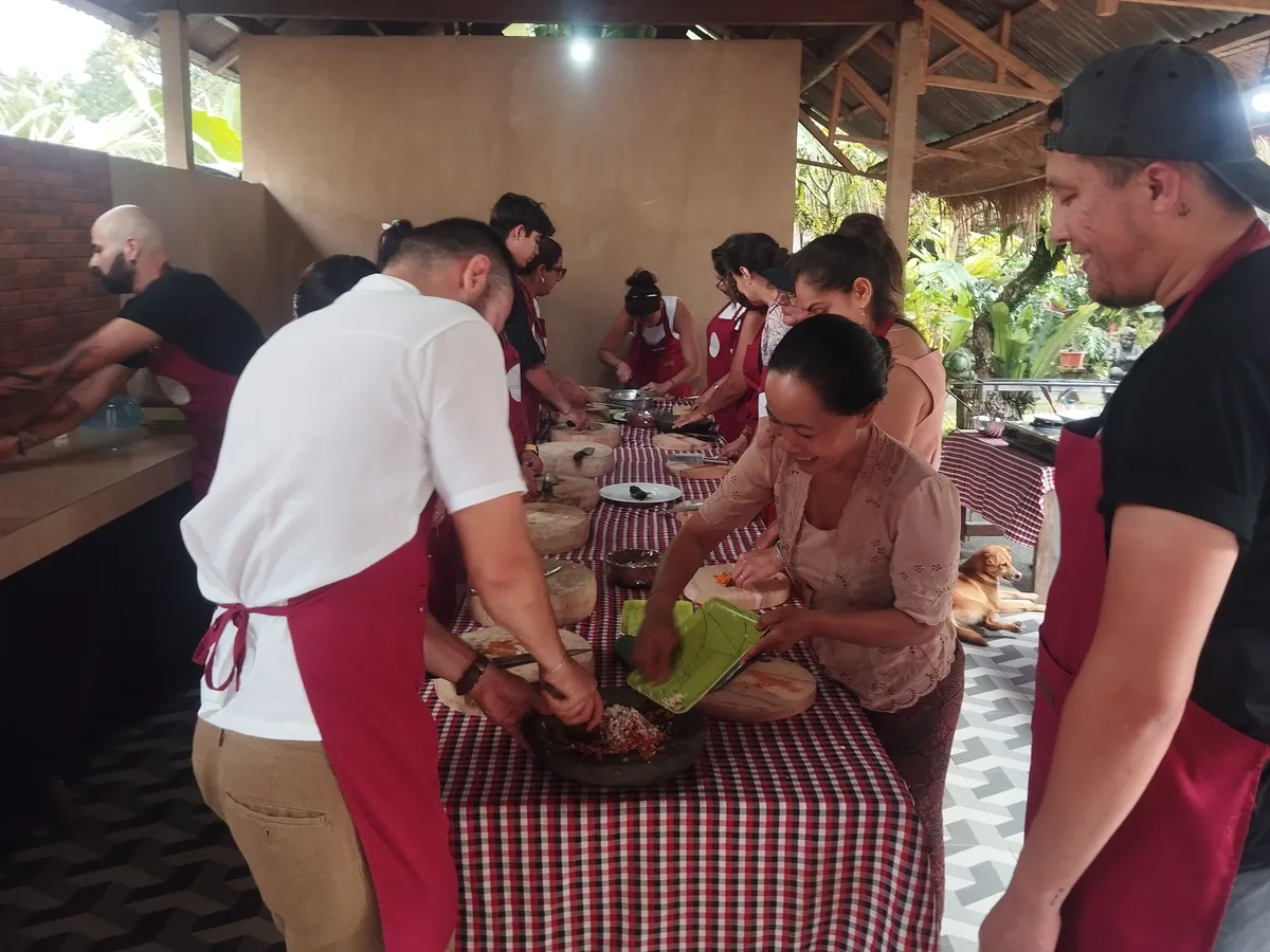 Guests preparing Balinese food together during a cooking class